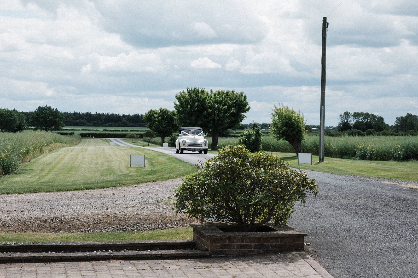 A vintage wedding car on the driveway