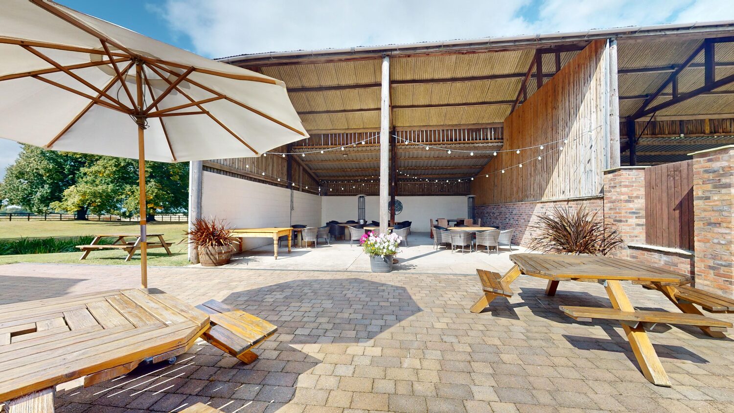 The Outside Barn, a covered shelter open to the lawn