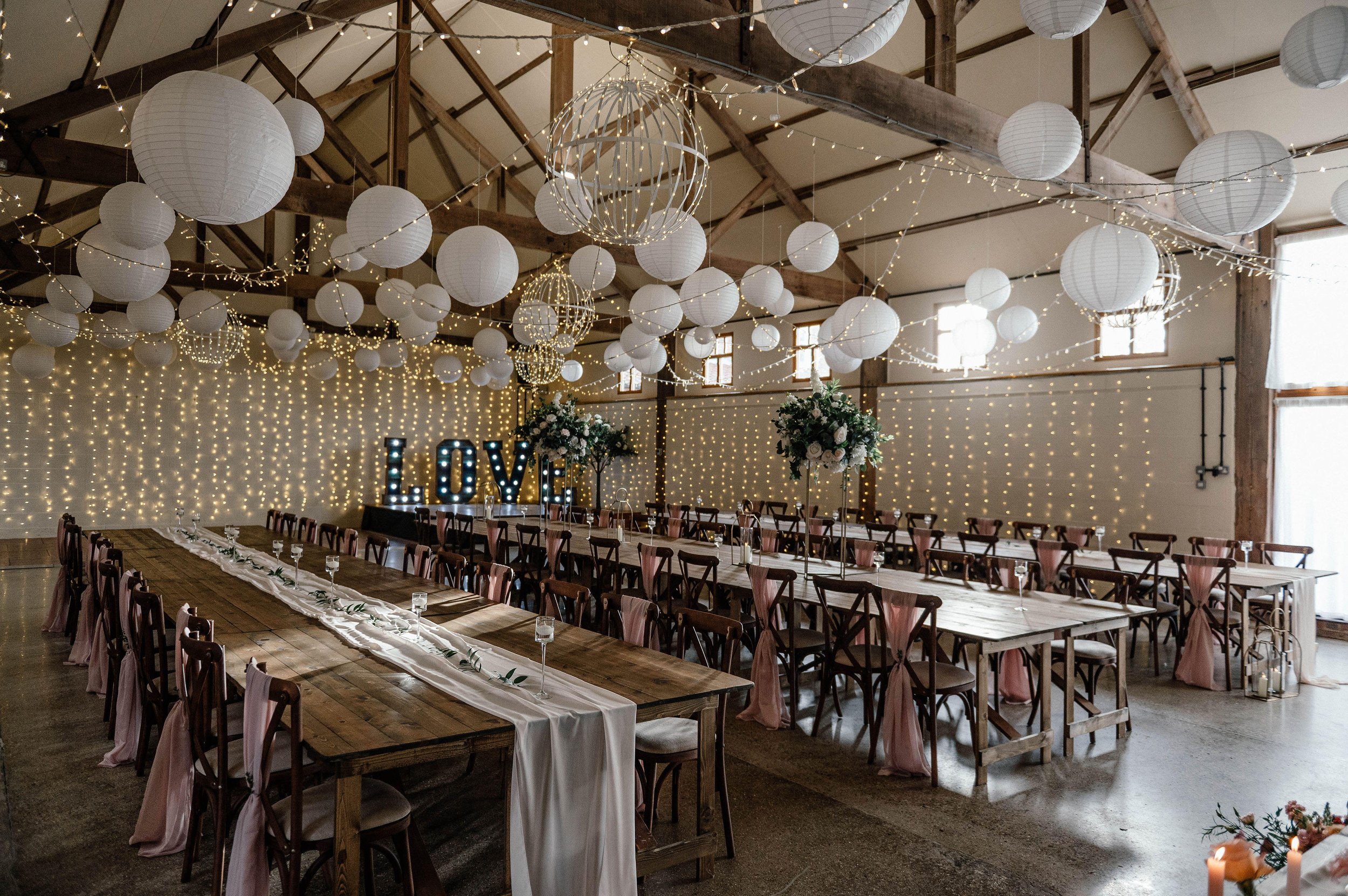 The Main Barn with paper lanterns and a fairy-light wall